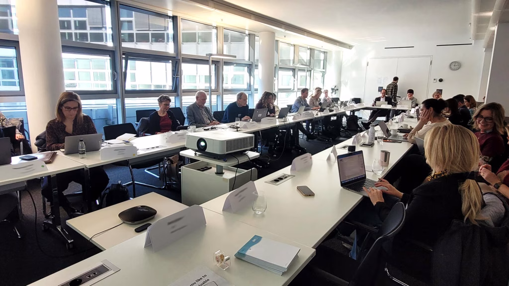 People at a table working together in a workshop