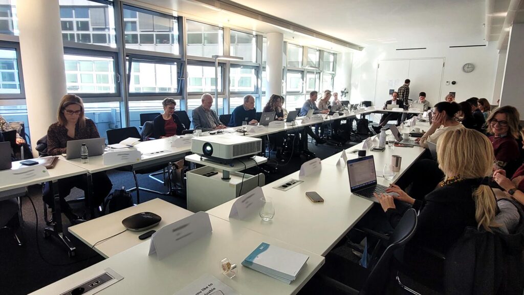 People at a table working together in a workshop